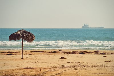 Scenic view of beach against clear sky