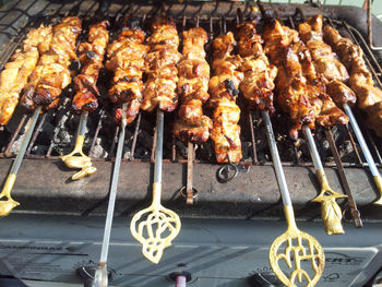 High angle view of meat on barbecue grill