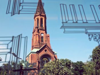 Low angle view of bell tower against sky