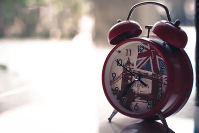 Close-up of clock on table