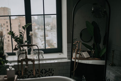 Luxury interior of big bathroom at modern african style with oval bathtub in natural lighting