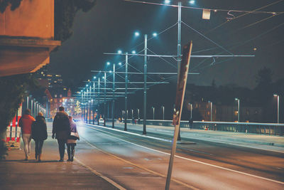 Walking together over a bridge in the city