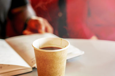 Close-up of coffee cup on table