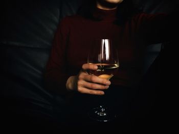 Close-up of man holding wineglass