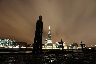 Silhouette of tower against sky at sunset