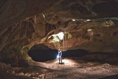 Man standing in cave