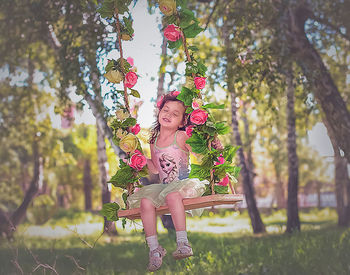 Portrait of woman with pink flower tree