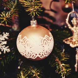 Close-up of christmas decoration hanging on tree