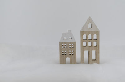 Close-up of toy on table against white background