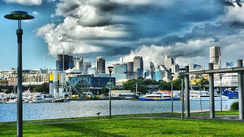 Cityscape against cloudy sky