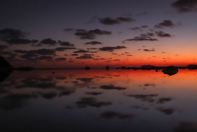 Scenic view of sea against romantic sky at sunset