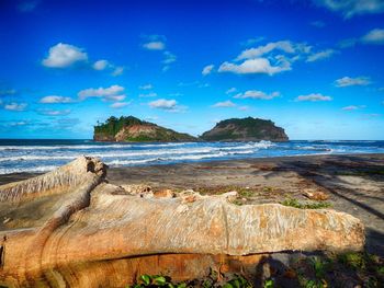 Scenic view of sea against blue sky