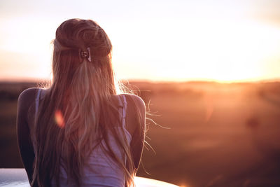 Woman looking at sunset