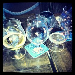 Close-up of wine glasses on table