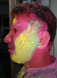 Close-up portrait of a boy with multi colored background