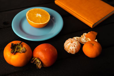 High angle view of orange fruits on table