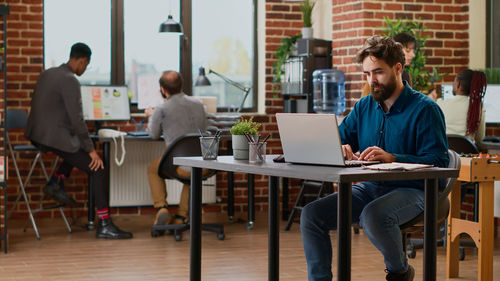 Man using laptop at office