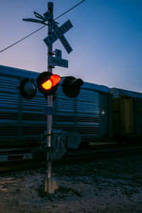 Illuminated stoplight in city at night