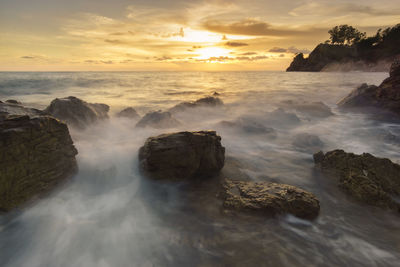 Scenic view of sea against sky during sunset