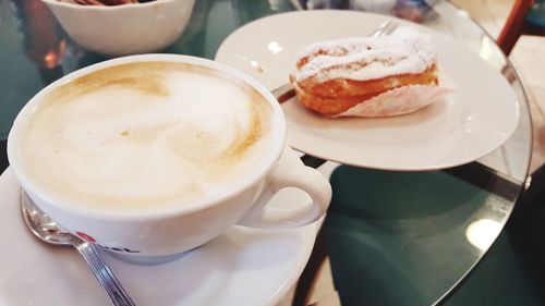 Close-up of cappuccino served on table