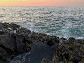 Scenic view of sea against sky during sunset