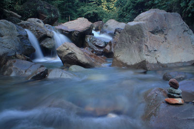 Scenic view of waterfall in river