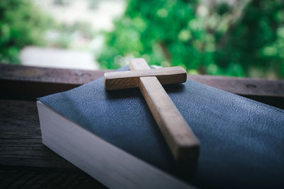 Close-up of cross on table