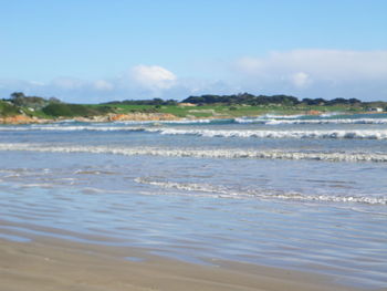 Scenic view of beach and sea against sky