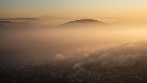 Scenic view of mountains against sky during sunset