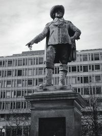 Low angle view of statue against building