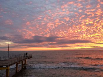 Scenic view of sea against sky at sunset