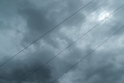 Low angle view of birds flying against sky