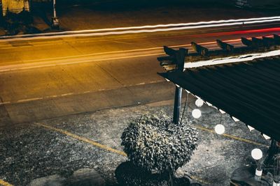 High angle view of an empty bench on footpath