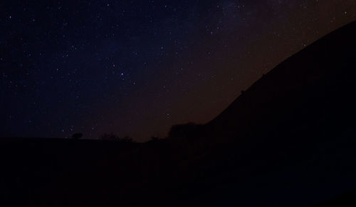 Scenic view of star field against sky at night