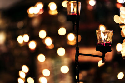 Close-up of illuminated lights at night