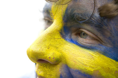 Close-up of human representation over white background