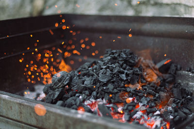 Close-up of charcoal burning in barbecue grill