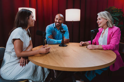 Side view of young man working at home