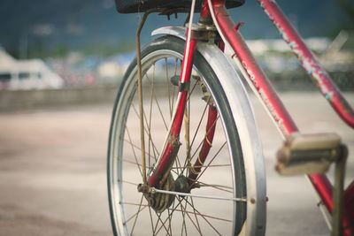 Close-up of bicycle parked on road