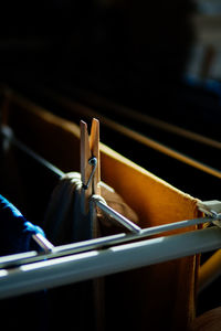 Sunlight falling on fabric with clothespin drying on rack