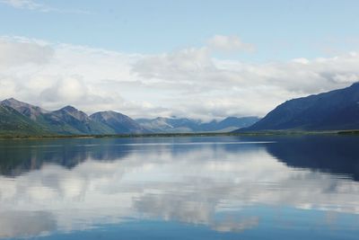 Scenic view of lake and mountains against sky