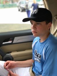 Man sitting in car