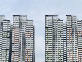 Low angle view of modern buildings against sky