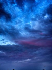 Low angle view of dramatic sky during sunset