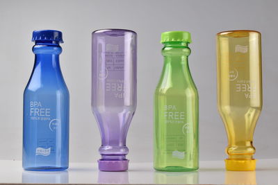 Close-up of empty bottles on table