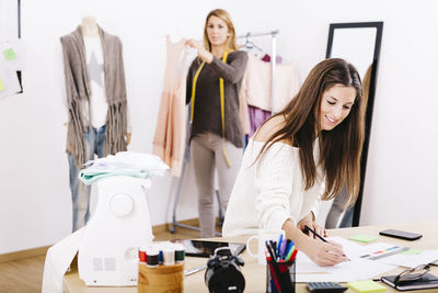 Young woman working in store