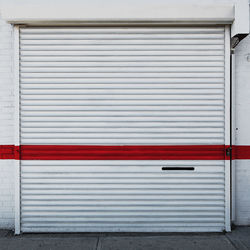Red paint on closed white shutter