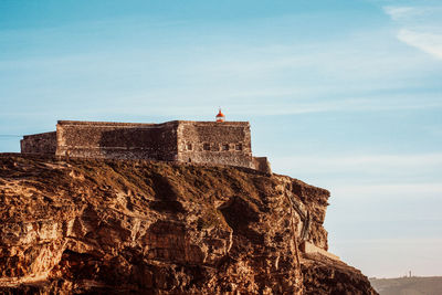 Low angle view of fort against sky