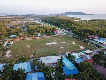 High angle view of trees and buildings against sky