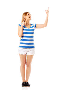 Full length of woman standing against white background